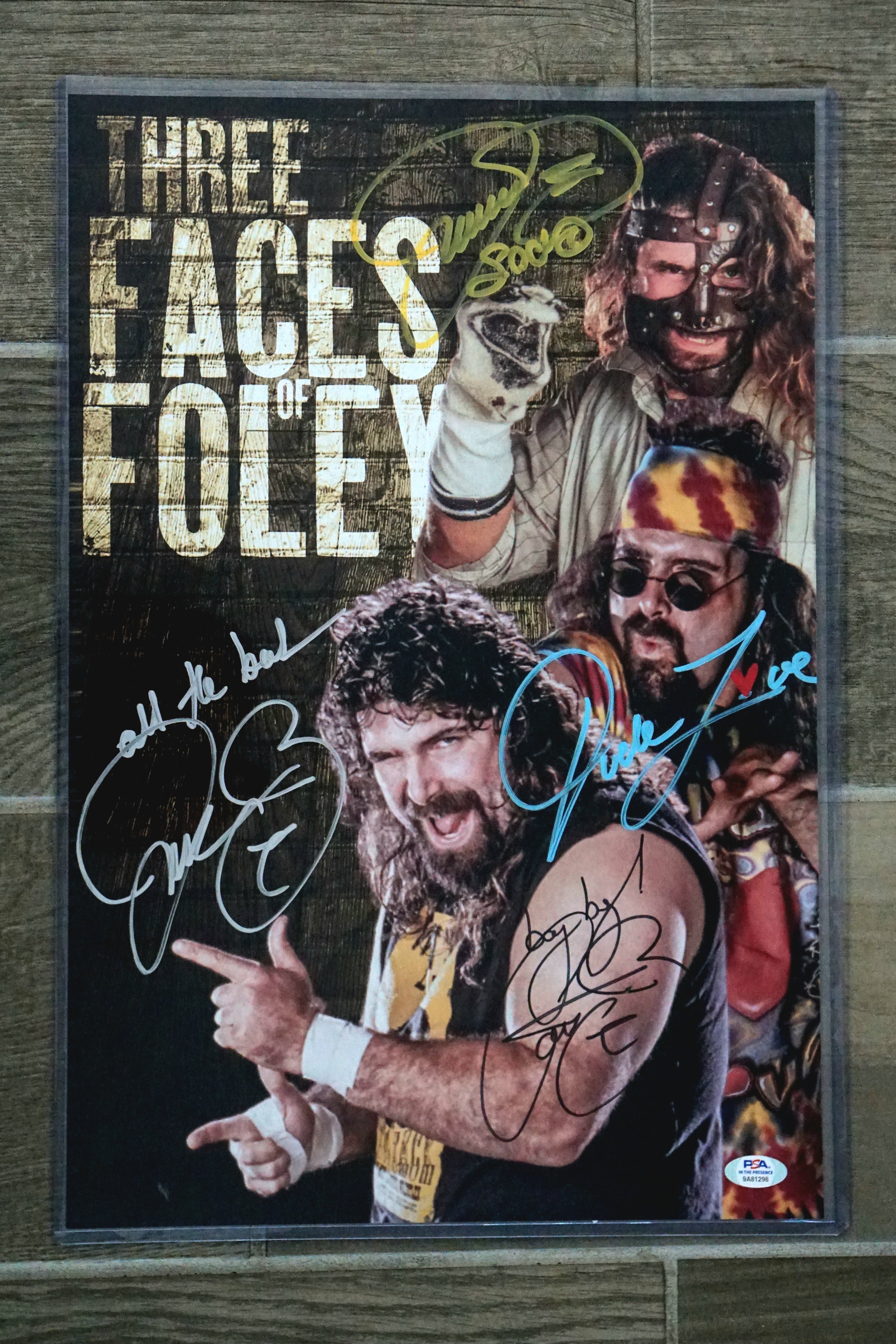 3 Faces of Foley 12x18 Yellow Mankind with inscriptions "Socko" Cactus jack as "Bang bang" Mick Foley as "All the Best" - Signed by Mick Foley by all 3 characters Mankind, Dude, Love Cactus Jack